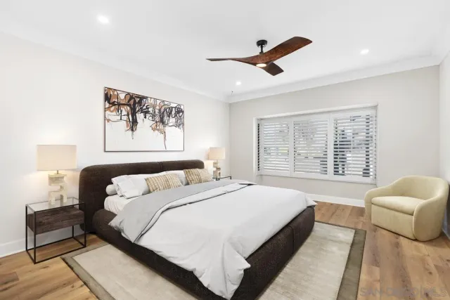 a bedroom with a bed and a couch