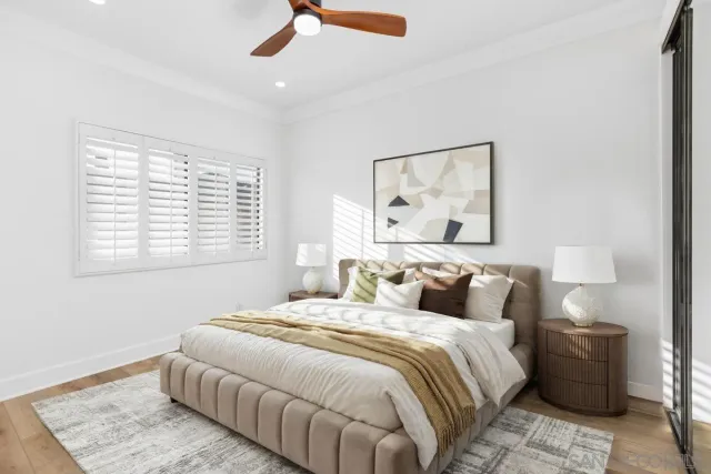 a bedroom with a bed and a window