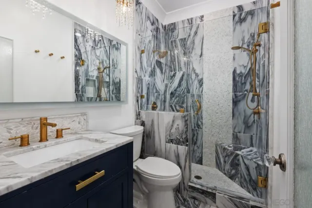 a bathroom with a sink toilet and shower