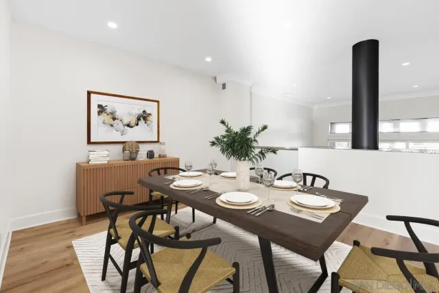 a view of a dining room with furniture and window