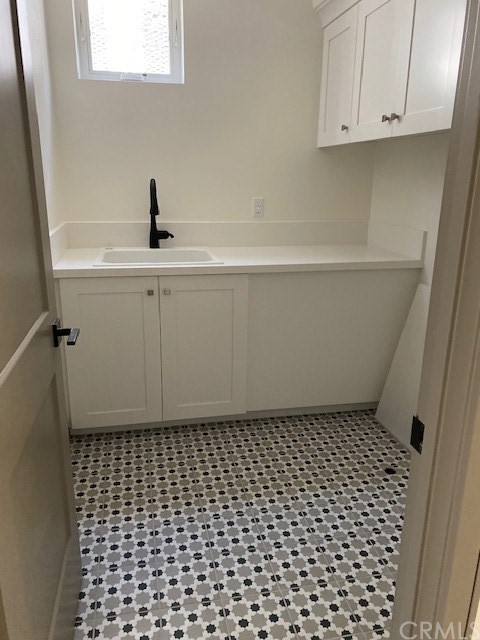 207 1st Street Seal Beach, CA 90740 - Photo 6 of 8 a bathroom with a granite countertop white bath tub