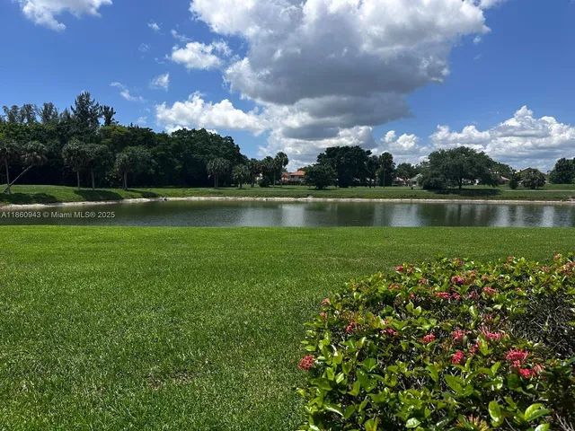 a view of a lake in between the house and lake view