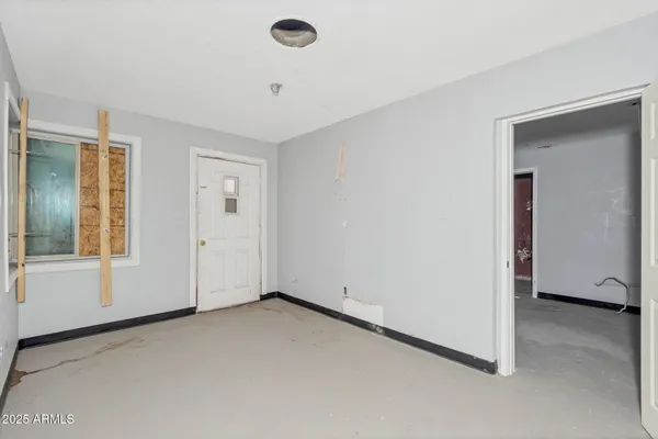 a bathroom with a bathtub and a window