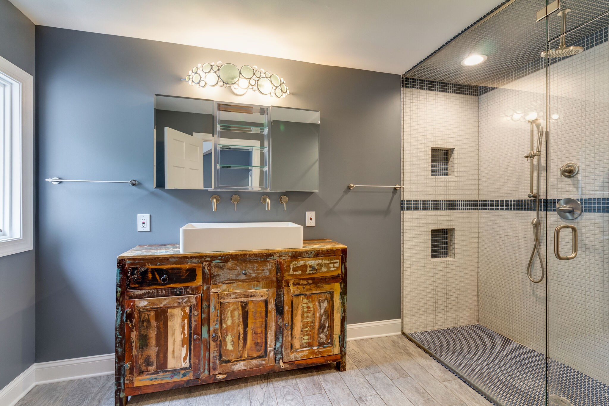 4036 Sneed Road Nashville, TN 37215 - Photo 15 of 24 a bathroom with a granite countertop sink a mirror and shower