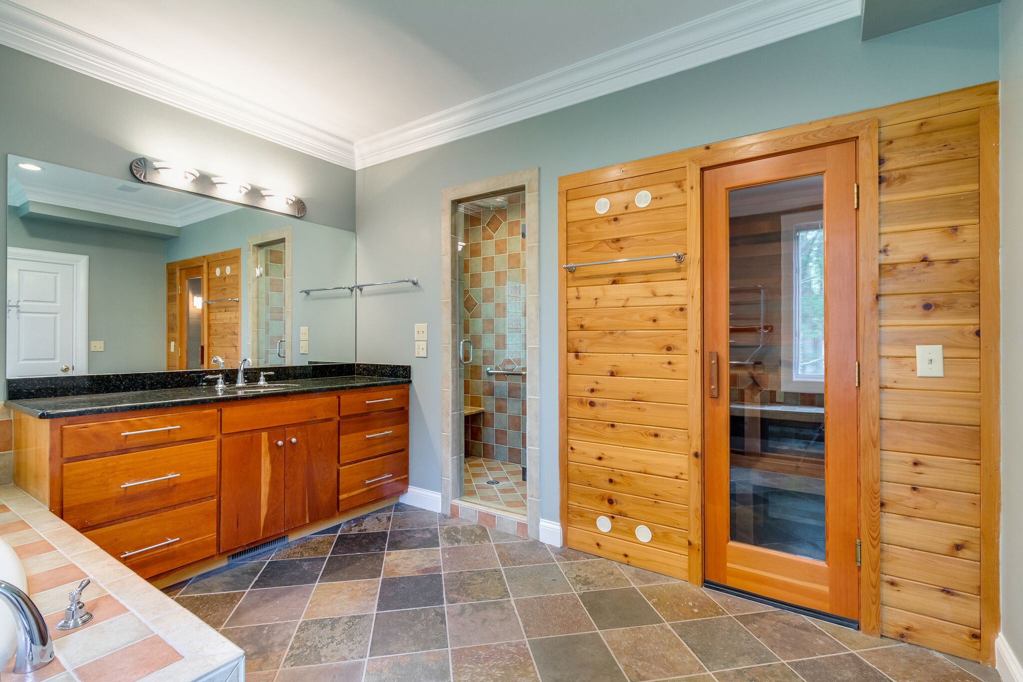 4036 Sneed Road Nashville, TN 37215 - Photo 20 of 24 a bathroom with a double vanity sink a mirror and a shower