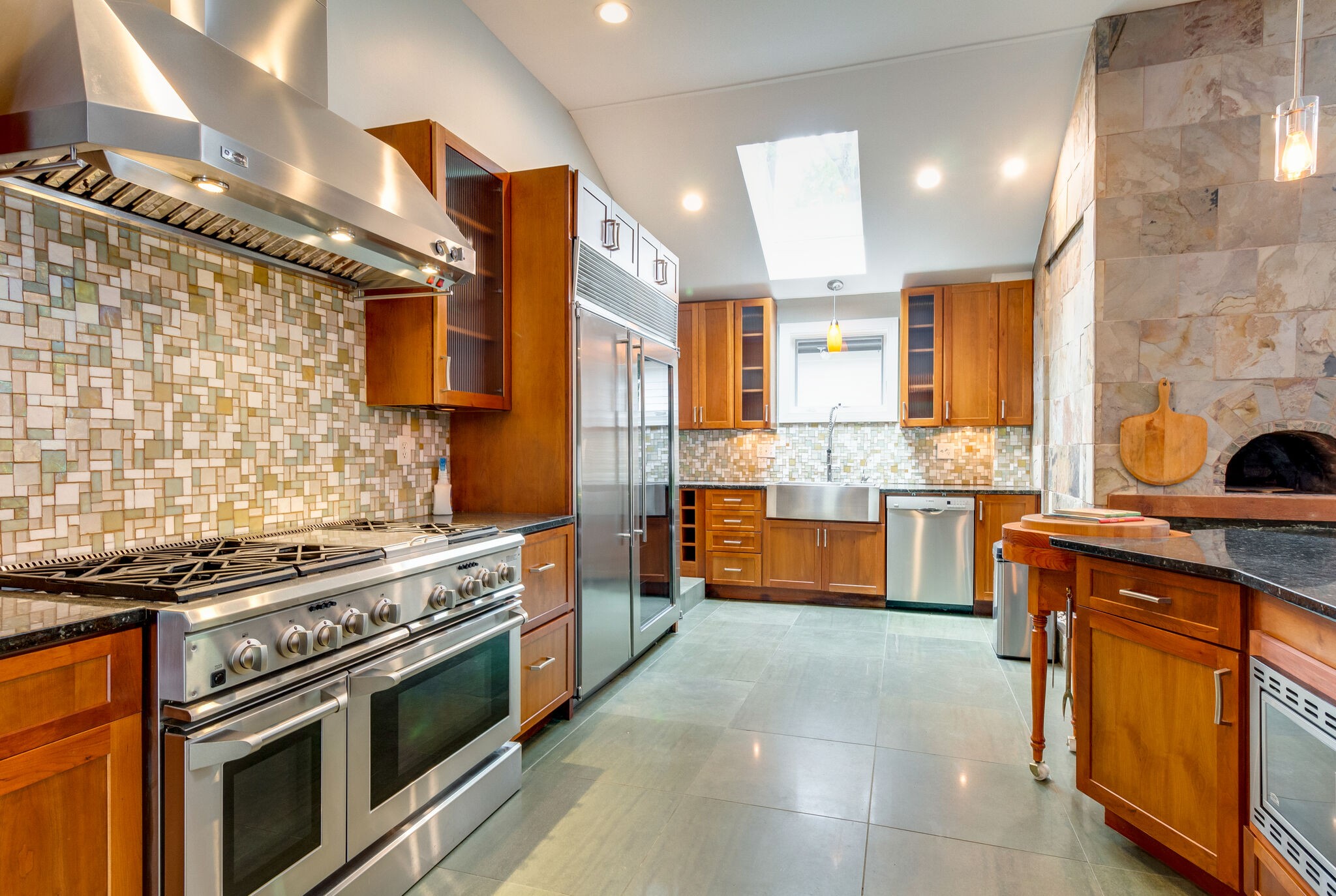 4036 Sneed Road Nashville, TN 37215 - Photo 2 of 24 a kitchen with stainless steel appliances a stove a sink and a microwave