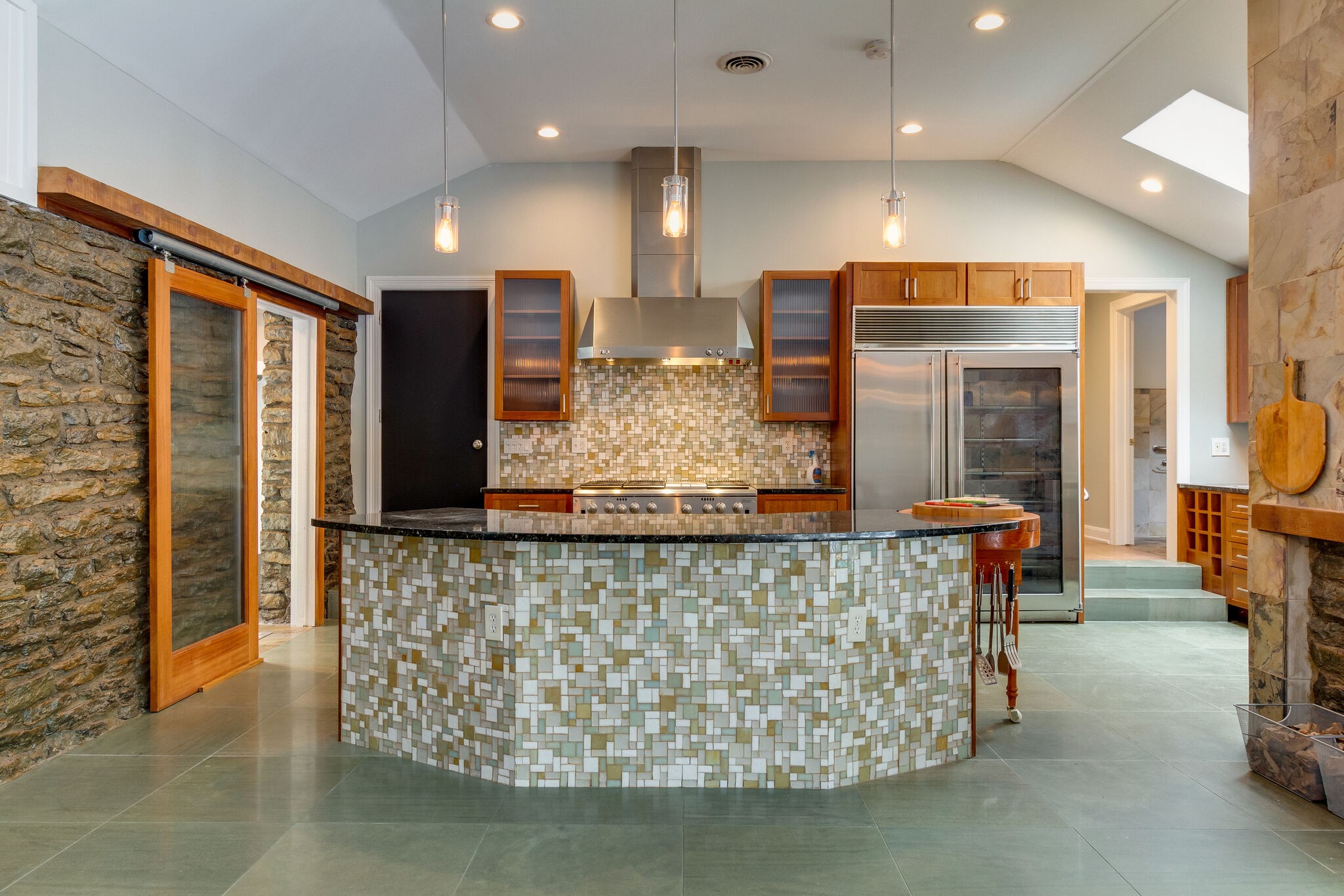 4036 Sneed Road Nashville, TN 37215 - Photo 6 of 24 a kitchen with stainless steel appliances kitchen island granite countertop a table and chairs