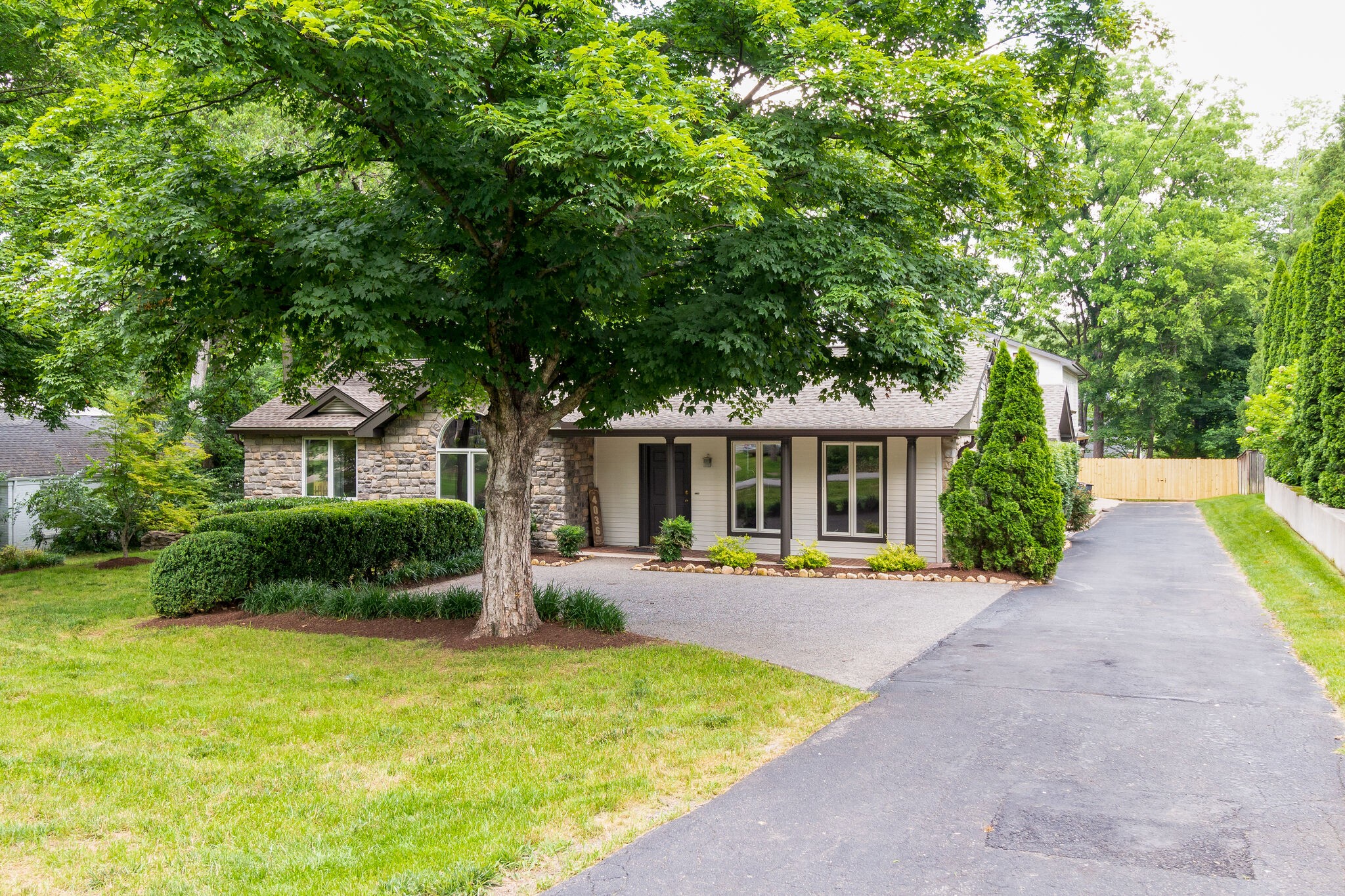 4036 Sneed Road Nashville, TN 37215 - Photo 10 of 24 a front view of a house with garden