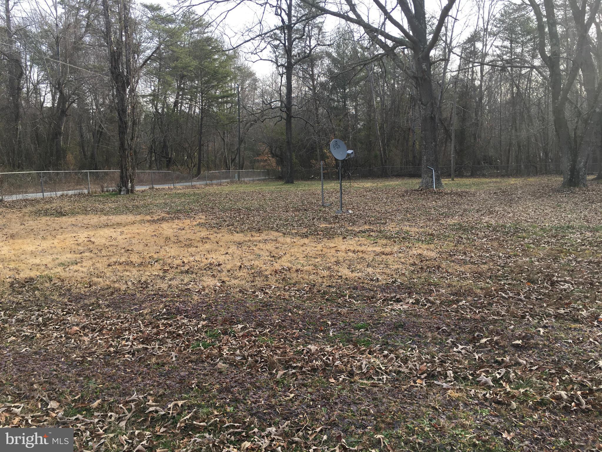 13228 Johnson Road King George, VA 22485 - Photo 14 of 18 a backyard of a house with lots of plants and trees
