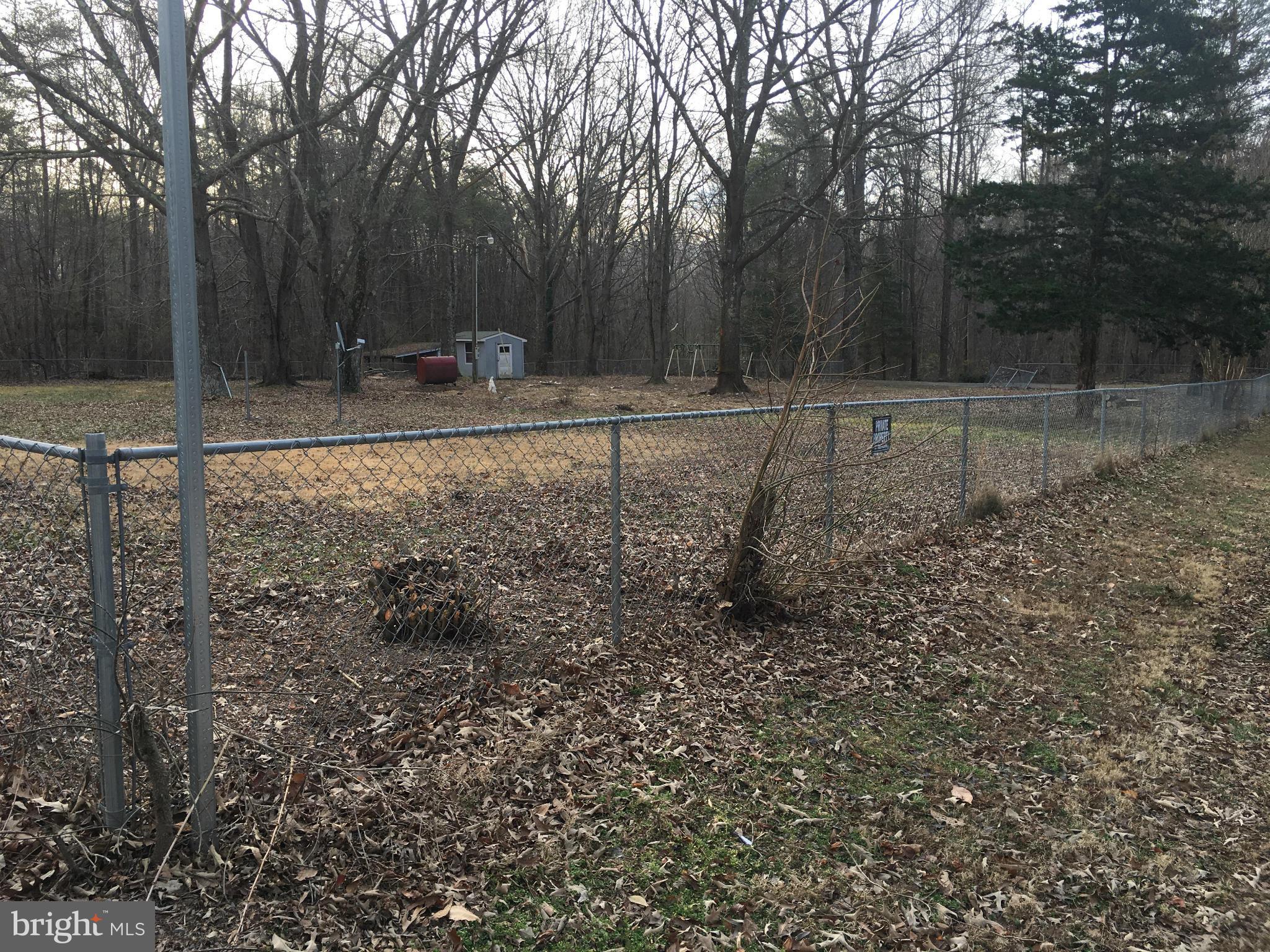 13228 Johnson Road King George, VA 22485 - Photo 7 of 18 a backyard of a house with lots of green space