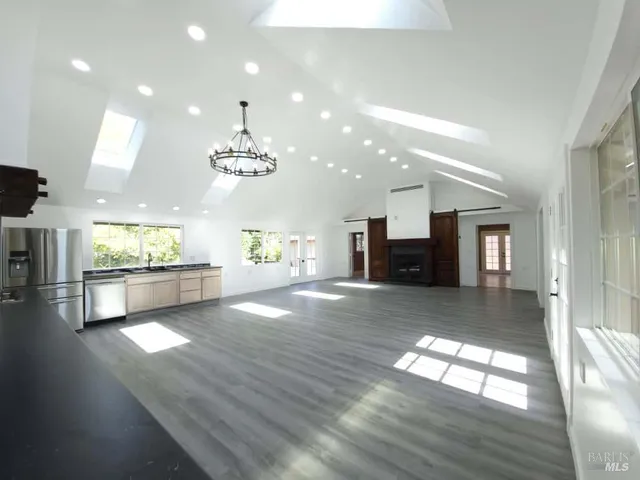 a view of a kitchen with a sink and a window