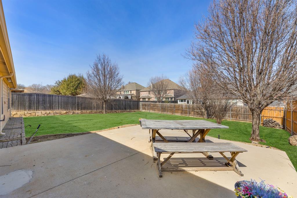 5129 Leeray Road Fort Worth, TX 76244 - Photo 15 of 39 a view of a patio with a yard