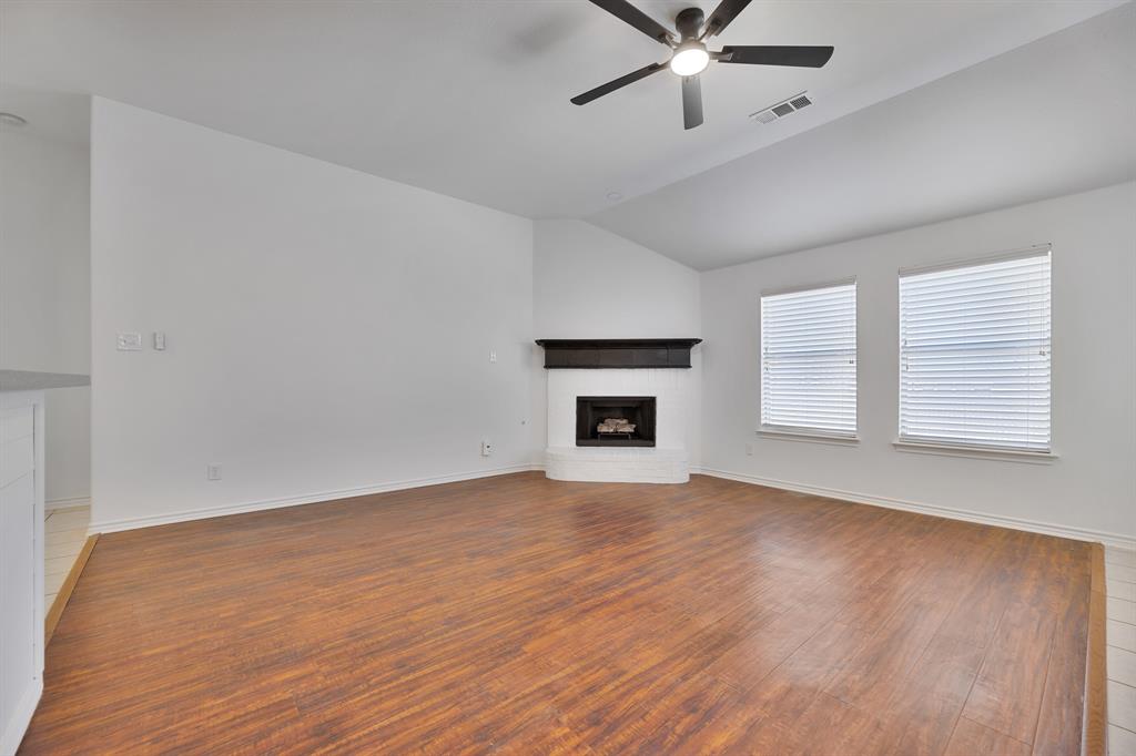5129 Leeray Road Fort Worth, TX 76244 - Photo 16 of 39 an empty room with windows and fireplace