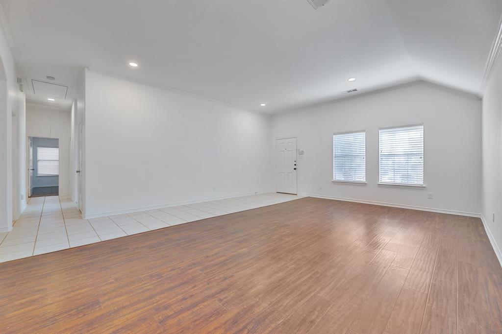 5129 Leeray Road Fort Worth, TX 76244 - Photo 20 of 39 an empty room with wooden floor and windows