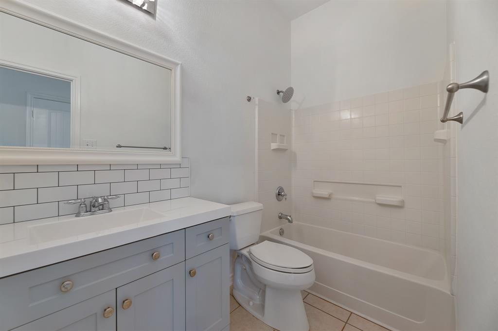 5129 Leeray Road Fort Worth, TX 76244 - Photo 21 of 39 a bathroom with a sink a toilet and shower