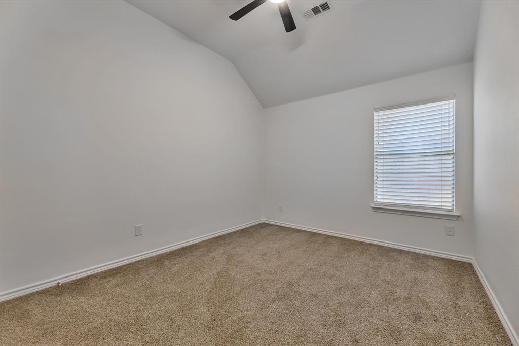 5129 Leeray Road Fort Worth, TX 76244 - Photo 26 of 39 an empty room with a window and a ceiling fan