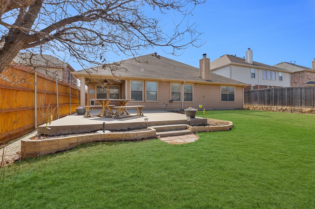 5129 Leeray Road Fort Worth, TX 76244 - Photo 3 of 39 a front view of a house with garden and a patio