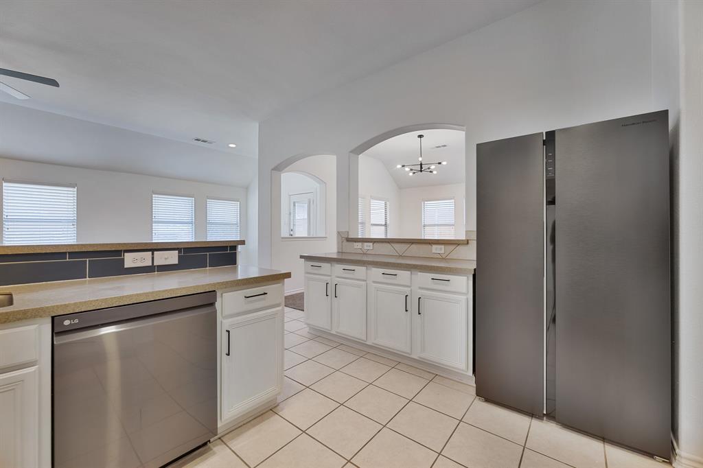 5129 Leeray Road Fort Worth, TX 76244 - Photo 31 of 39 a kitchen with a sink and cabinets