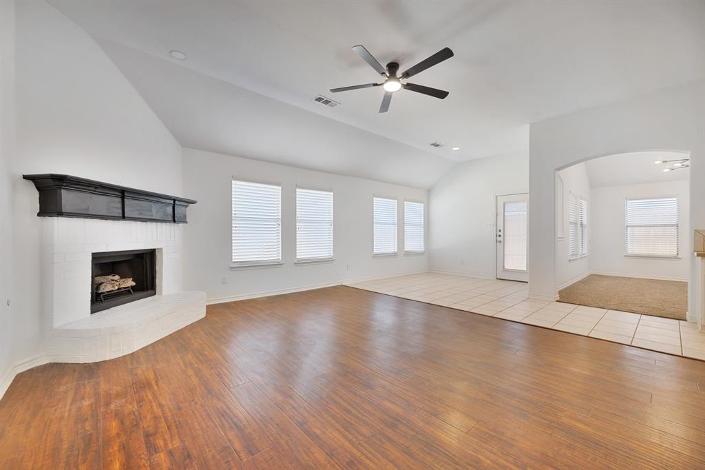 5129 Leeray Road Fort Worth, TX 76244 - Photo 33 of 39 an empty room with windows and fireplace