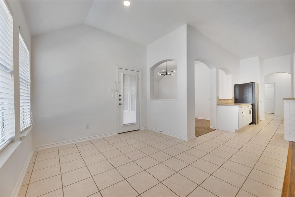 5129 Leeray Road Fort Worth, TX 76244 - Photo 34 of 39 a view of a kitchen with white cabinets