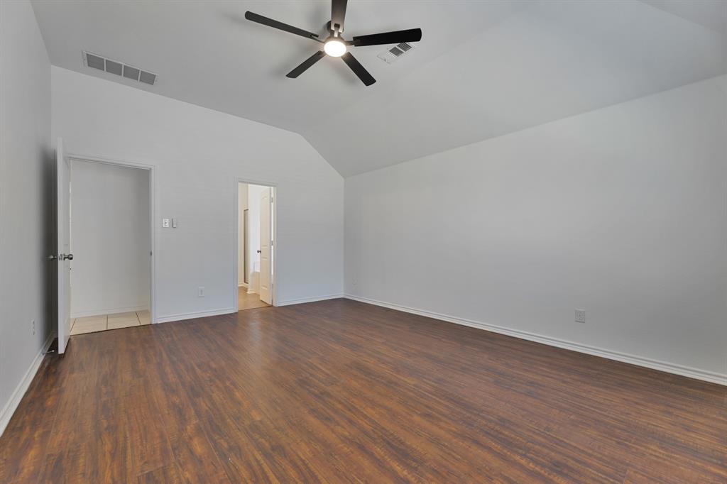 5129 Leeray Road Fort Worth, TX 76244 - Photo 36 of 39 a view of an empty room with wooden floor