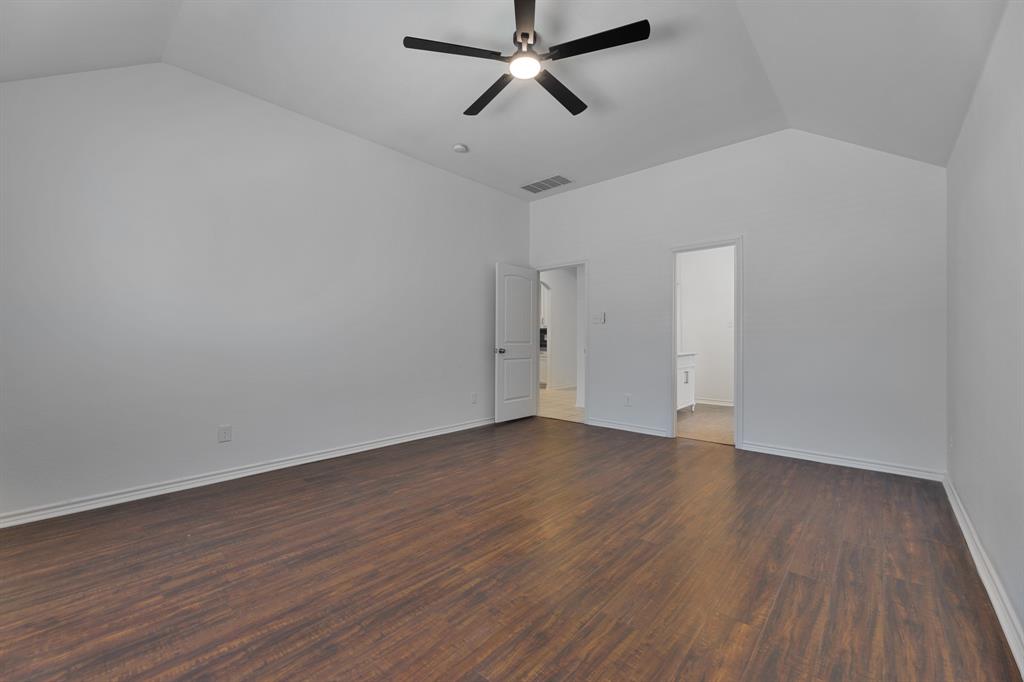 5129 Leeray Road Fort Worth, TX 76244 - Photo 37 of 39 a view of an empty room with wooden floor