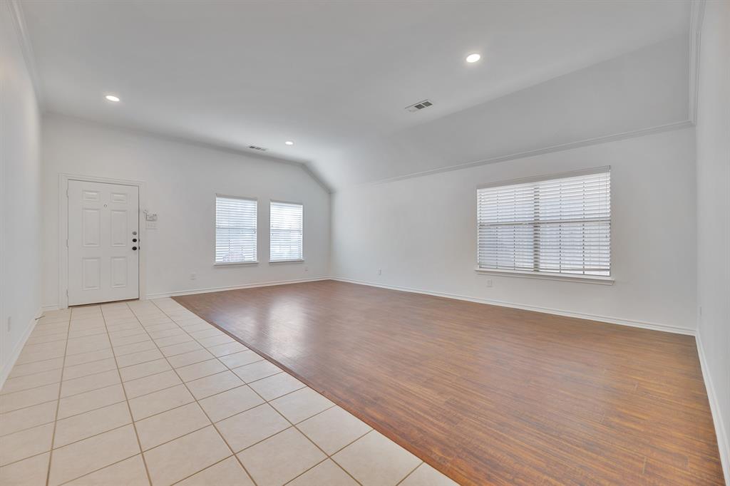 5129 Leeray Road Fort Worth, TX 76244 - Photo 5 of 39 an empty room with windows and closet