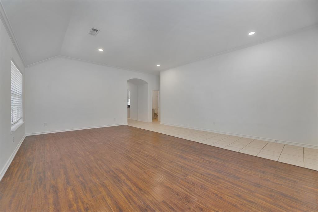5129 Leeray Road Fort Worth, TX 76244 - Photo 7 of 39 a view of an empty room with wooden floor