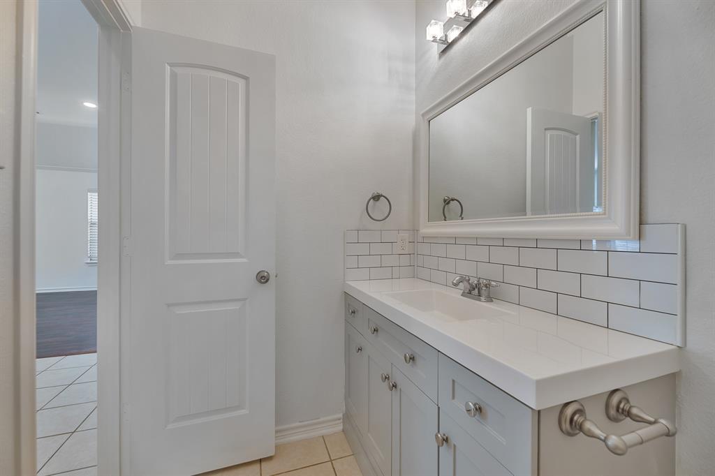 5129 Leeray Road Fort Worth, TX 76244 - Photo 9 of 39 a bathroom with a sink and a mirror