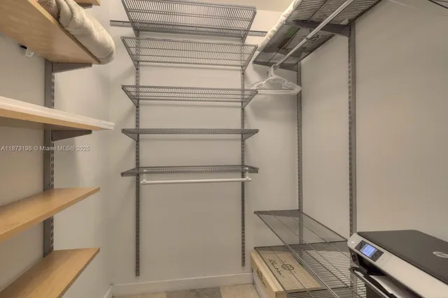 a view of an empty walk in closet