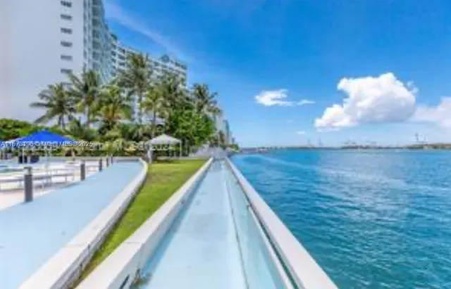 a view of a swimming pool with an outdoor seating