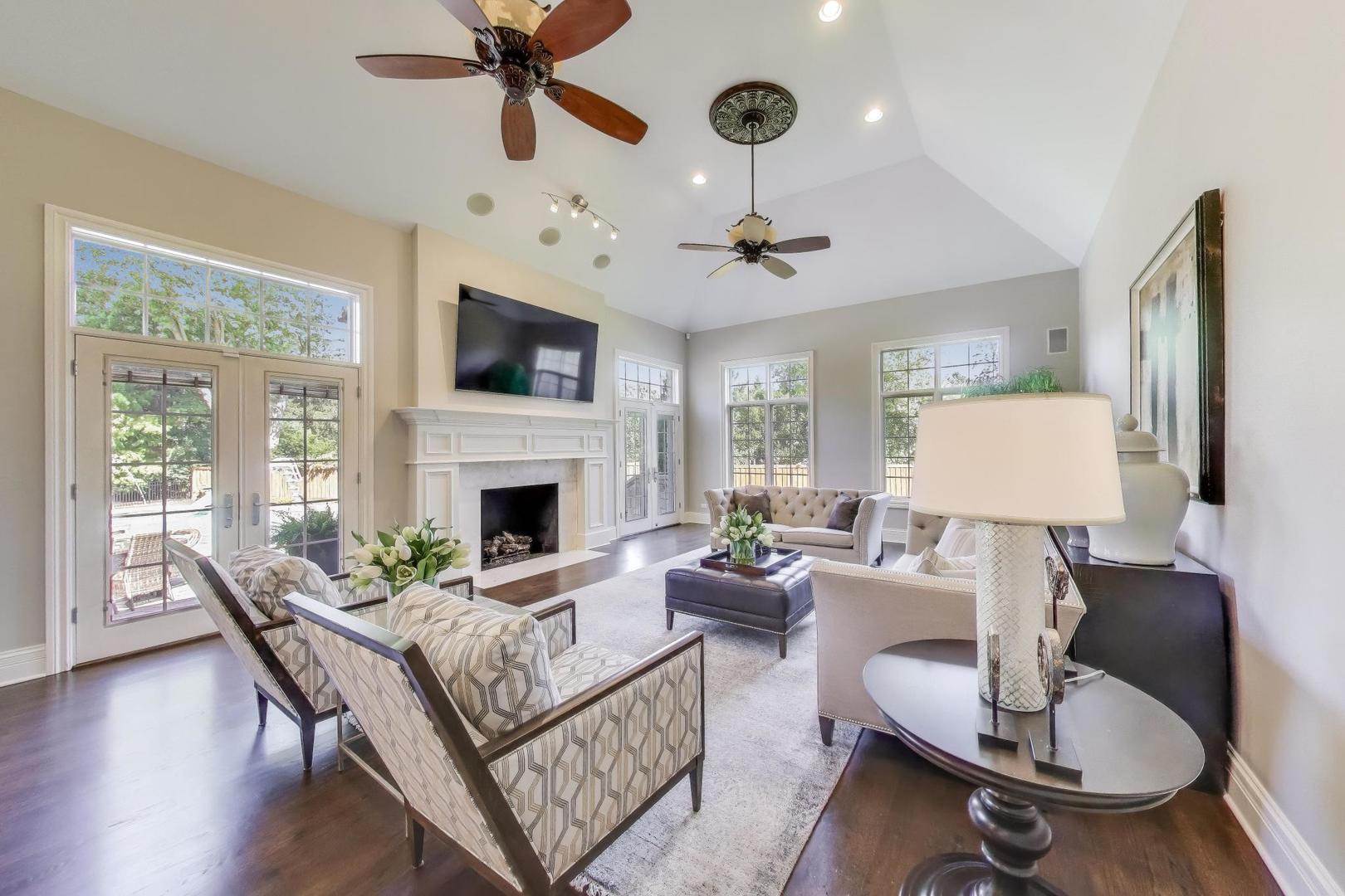 19 Meadowview Road Northfield, IL 60093 - Photo 11 of 65 a living room with furniture a flat screen tv and a fireplace