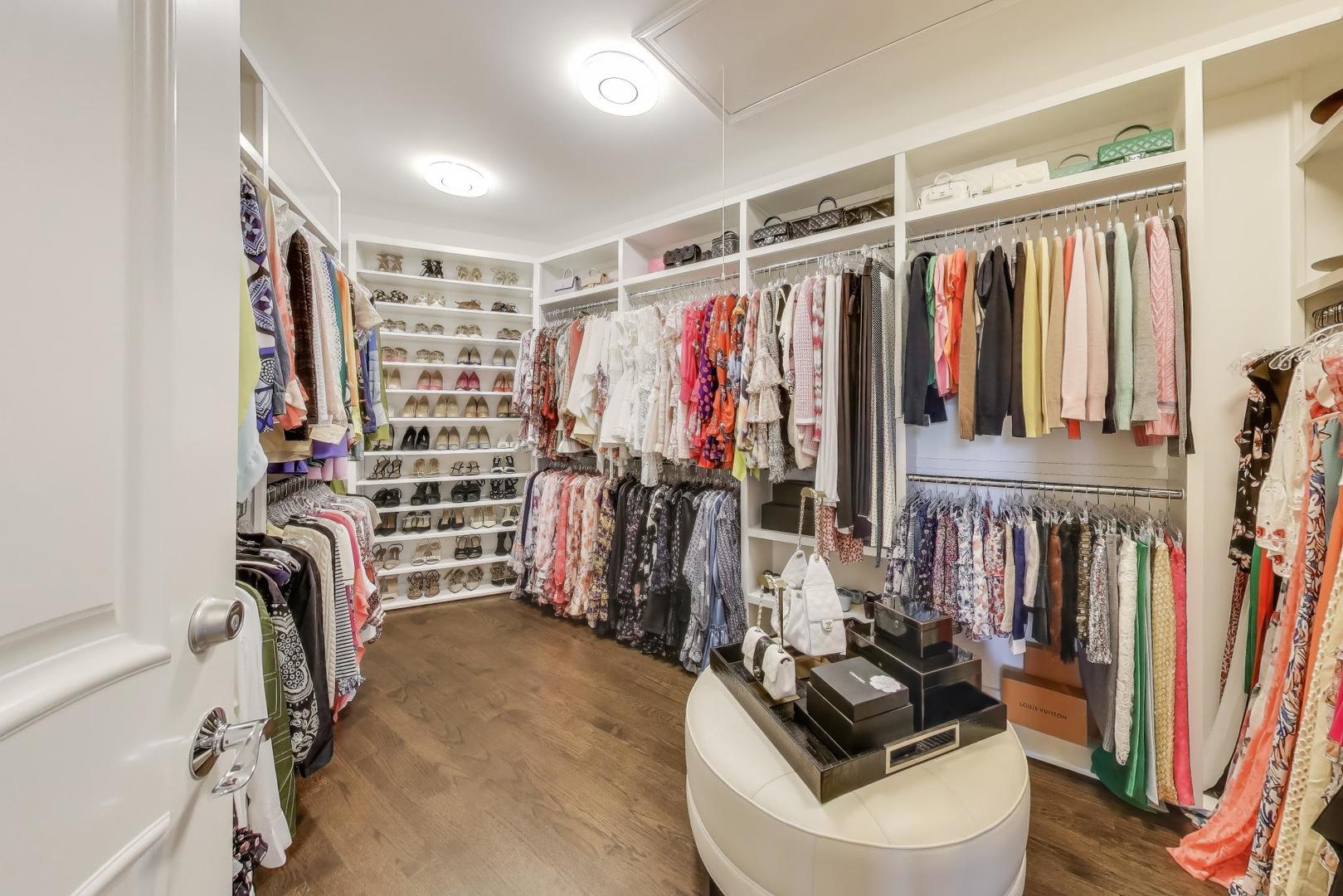 19 Meadowview Road Northfield, IL 60093 - Photo 29 of 65 a view of walk in closet with clothes and shoes