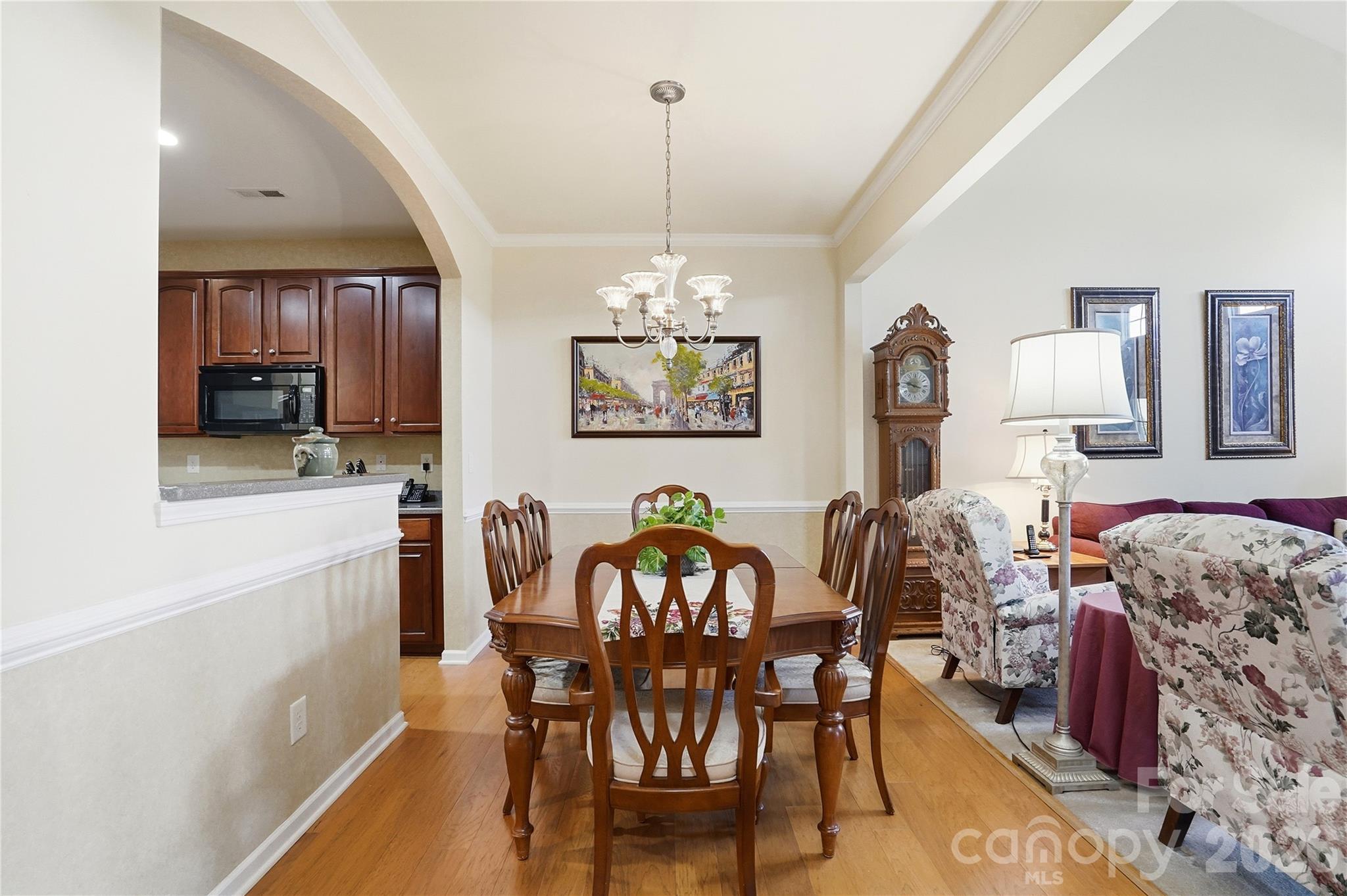 335 Garnet Court Fort Mill, SC 29708 - Photo 12 of 44 a view of a dining room with furniture and chandelier