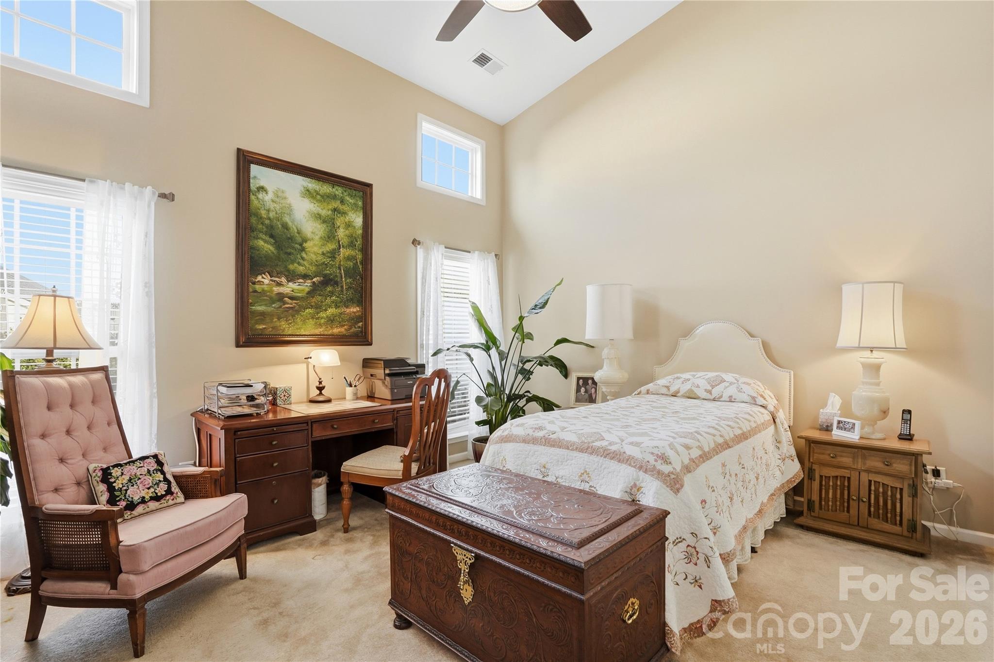 335 Garnet Court Fort Mill, SC 29708 - Photo 18 of 44 a bedroom with a bed and a chandelier