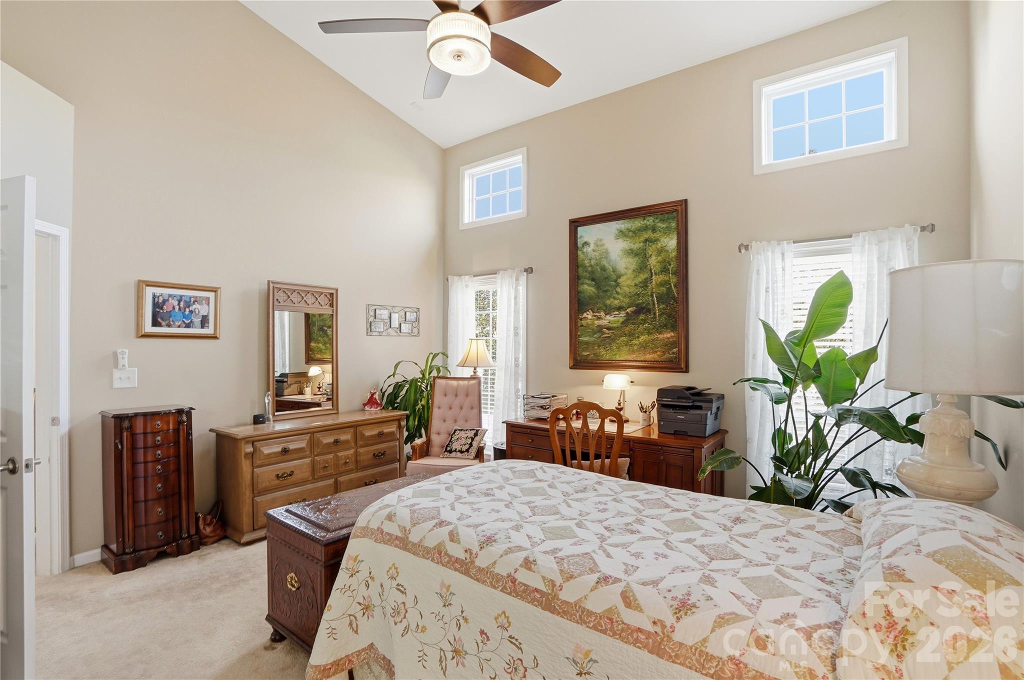 335 Garnet Court Fort Mill, SC 29708 - Photo 19 of 44 a bedroom with a bed table chair and a window
