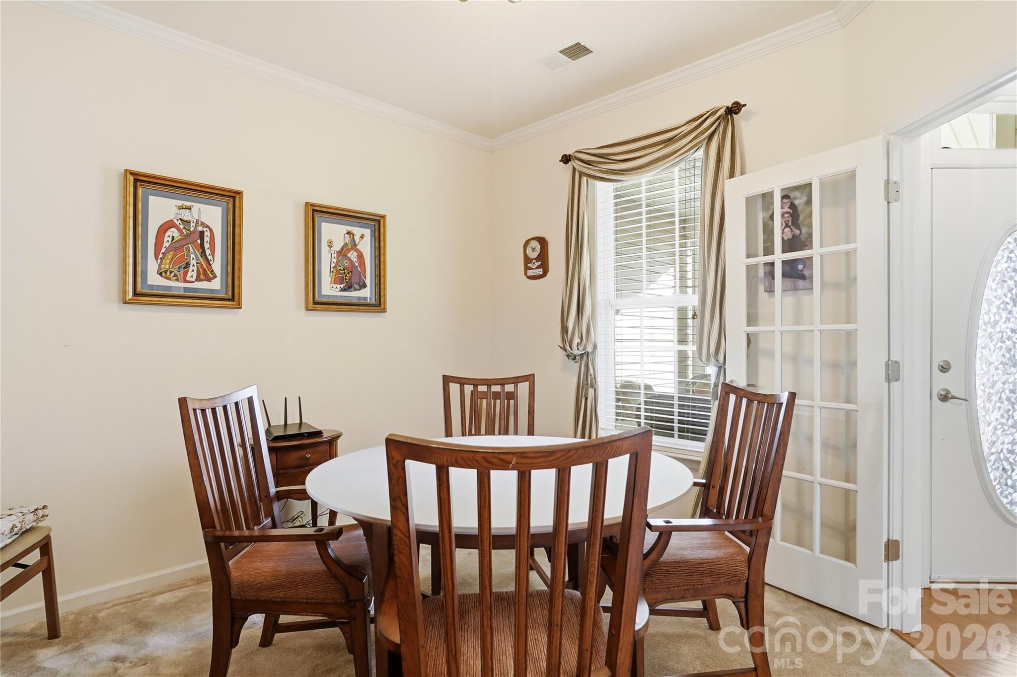 335 Garnet Court Fort Mill, SC 29708 - Photo 25 of 44 a view of a dining room with furniture wooden floor and a potted plant