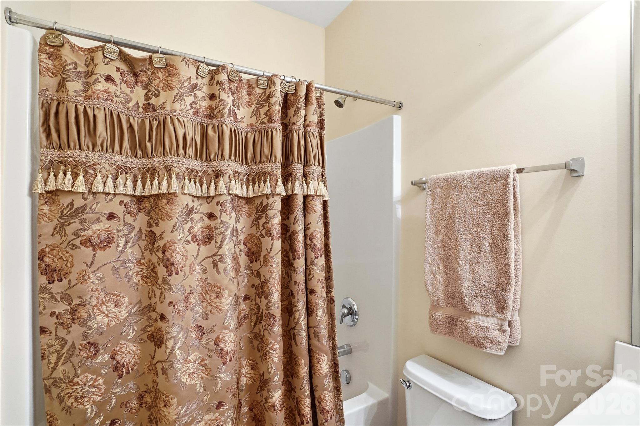 335 Garnet Court Fort Mill, SC 29708 - Photo 27 of 44 a bathroom with a shower curtain and a sink