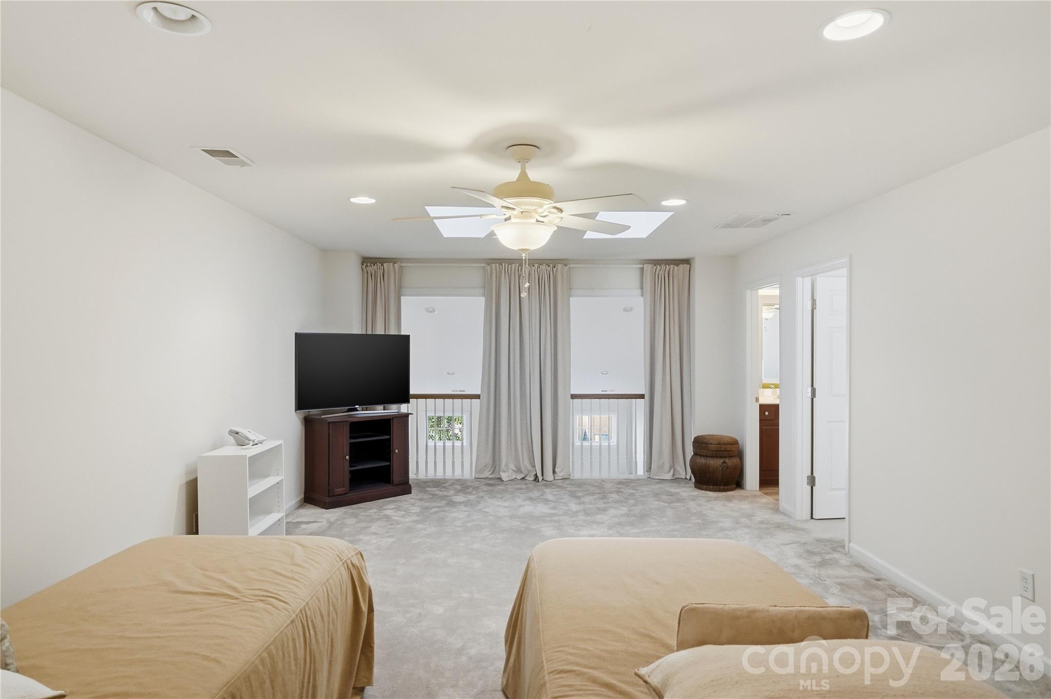 335 Garnet Court Fort Mill, SC 29708 - Photo 29 of 44 a bedroom with a bed and a flat screen tv