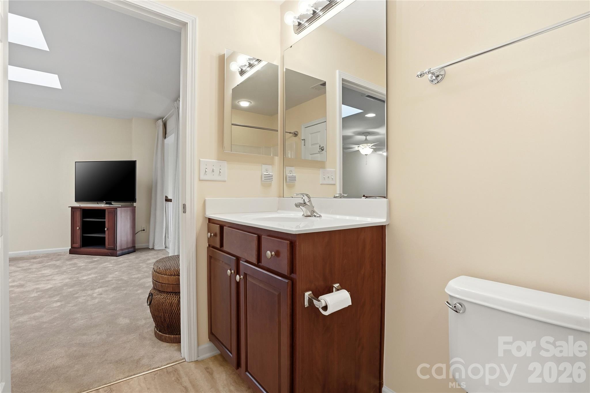 335 Garnet Court Fort Mill, SC 29708 - Photo 37 of 44 a bathroom with a sink and a mirror