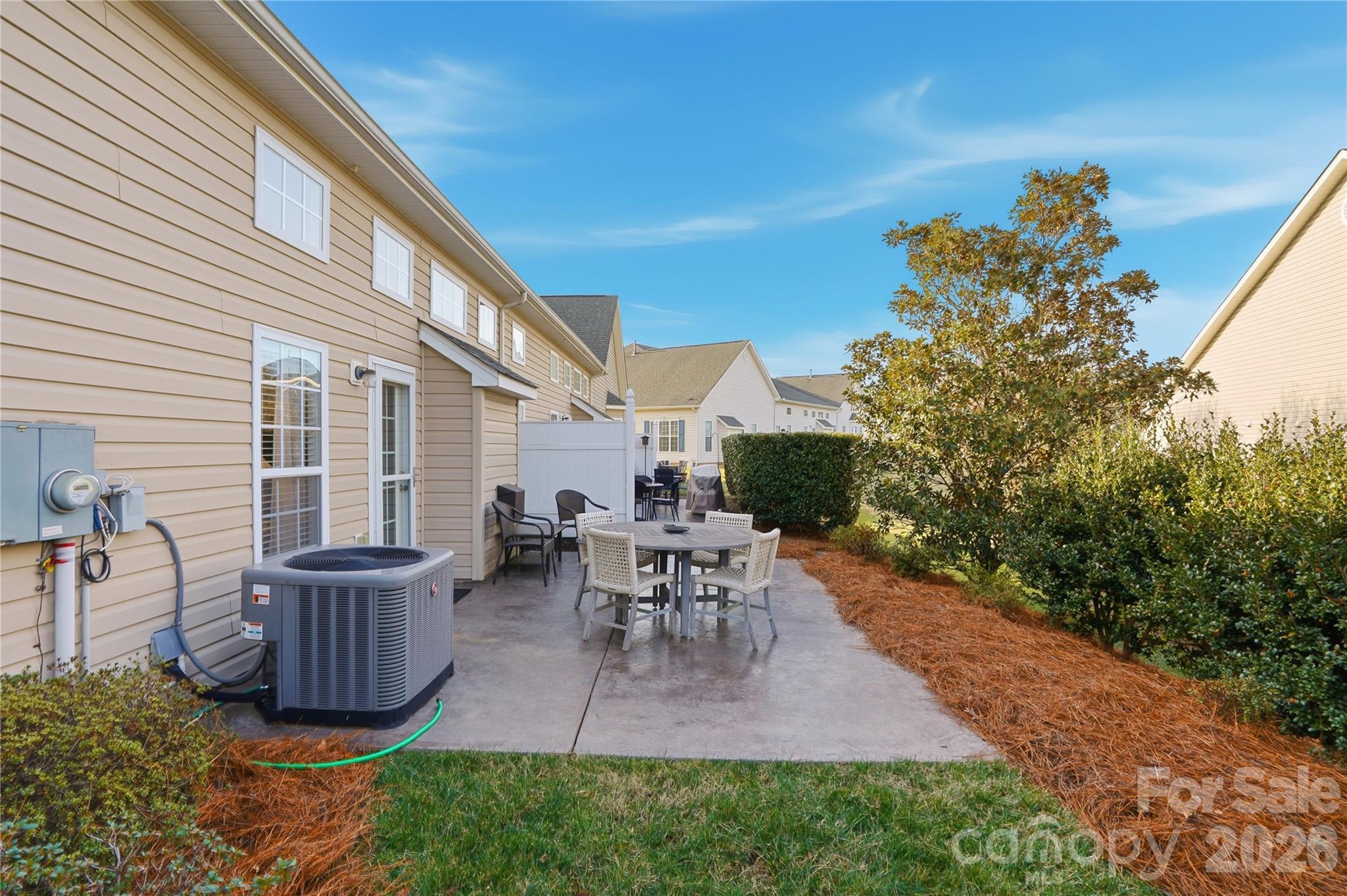 335 Garnet Court Fort Mill, SC 29708 - Photo 40 of 44 a view of a patio with couches chairs potted plants and a table