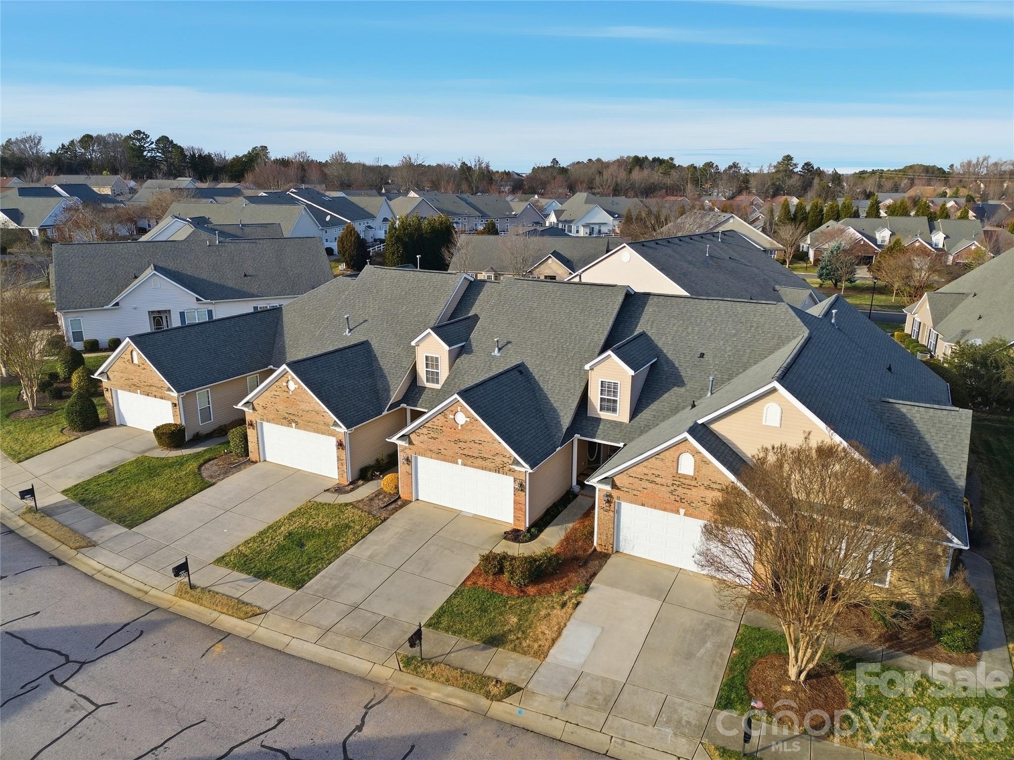 335 Garnet Court Fort Mill, SC 29708 - Photo 42 of 44 an aerial view of residential houses with city view