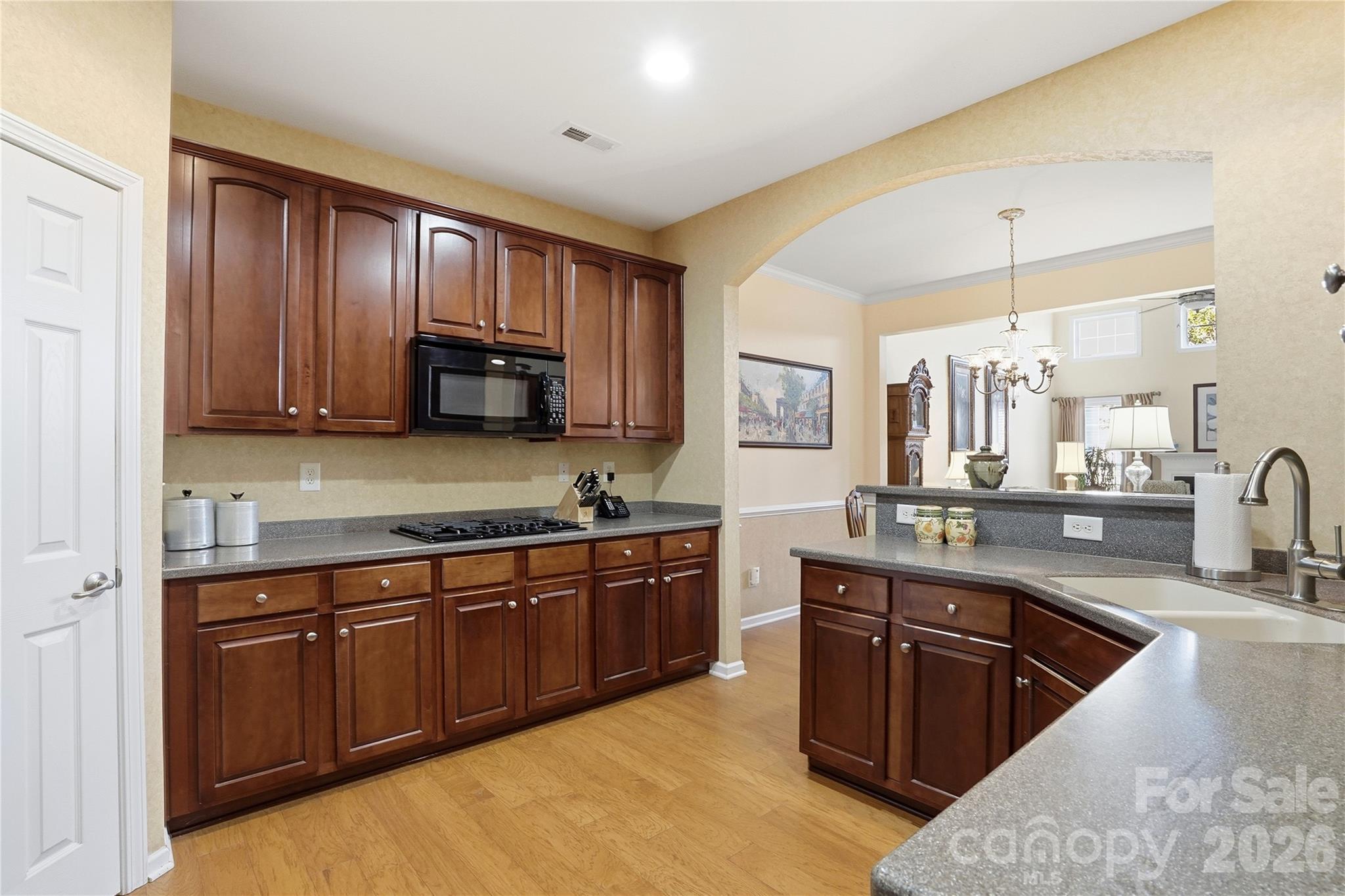 335 Garnet Court Fort Mill, SC 29708 - Photo 6 of 44 a large kitchen with stainless steel appliances granite countertop a stove sink and cabinets