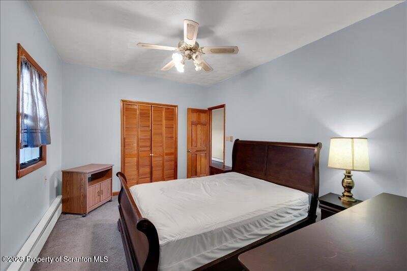 1228 Lake Road Factoryville, PA 18419 - Photo 30 of 43 a bedroom with a bed and window