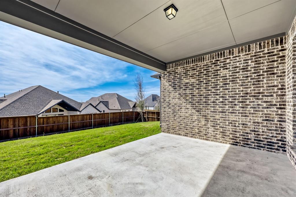 147 Derrett Lane Rhome, TX 76078 - Photo 23 of 28 Fenced backyard featuring a patio area and a residential view