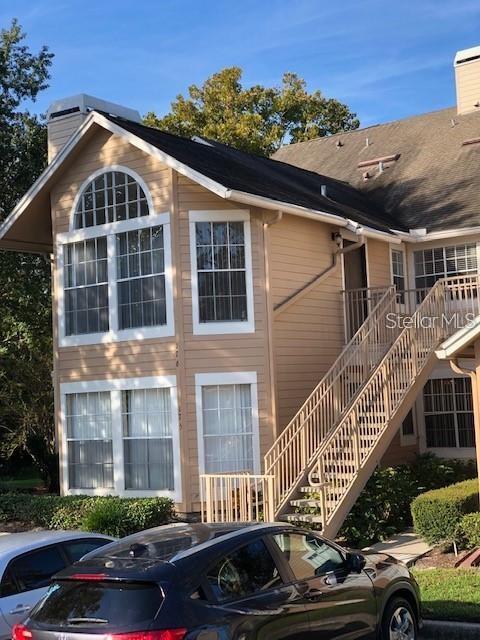 630 Steamboat Court, Unit 176 Altamonte Springs, FL 32714 - Photo 1 of 8 a front view of a house with a yard