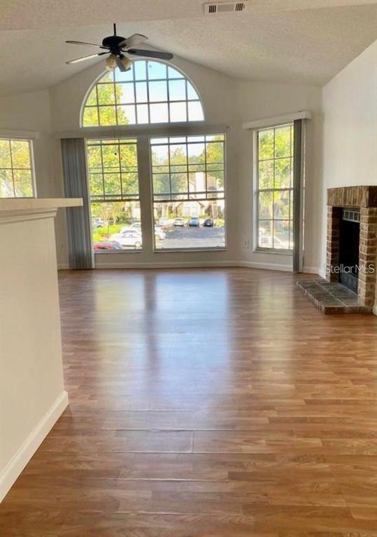 630 Steamboat Court, Unit 176 Altamonte Springs, FL 32714 - Photo 4 of 8 an empty room with wooden floor and windows