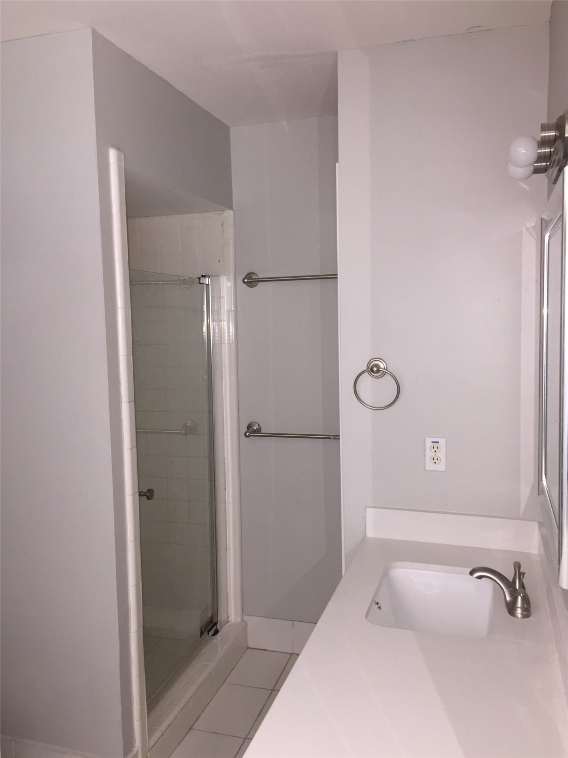 7902 Meadowcroft Drive Houston, TX 77063 - Photo 12 of 20 a bathroom with a sink and shower