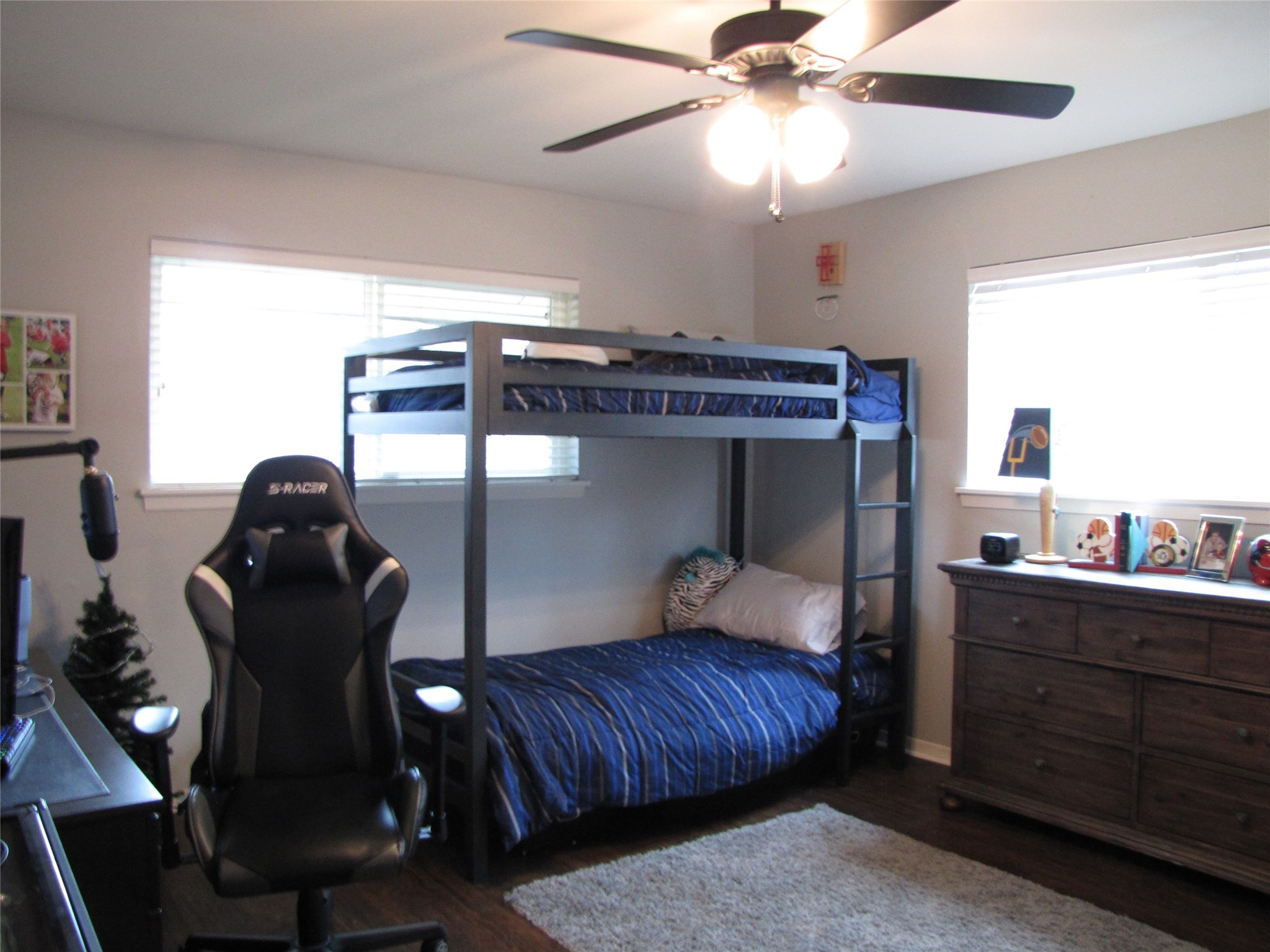 7902 Meadowcroft Drive Houston, TX 77063 - Photo 8 of 20 a bedroom with a bed and a chandelier