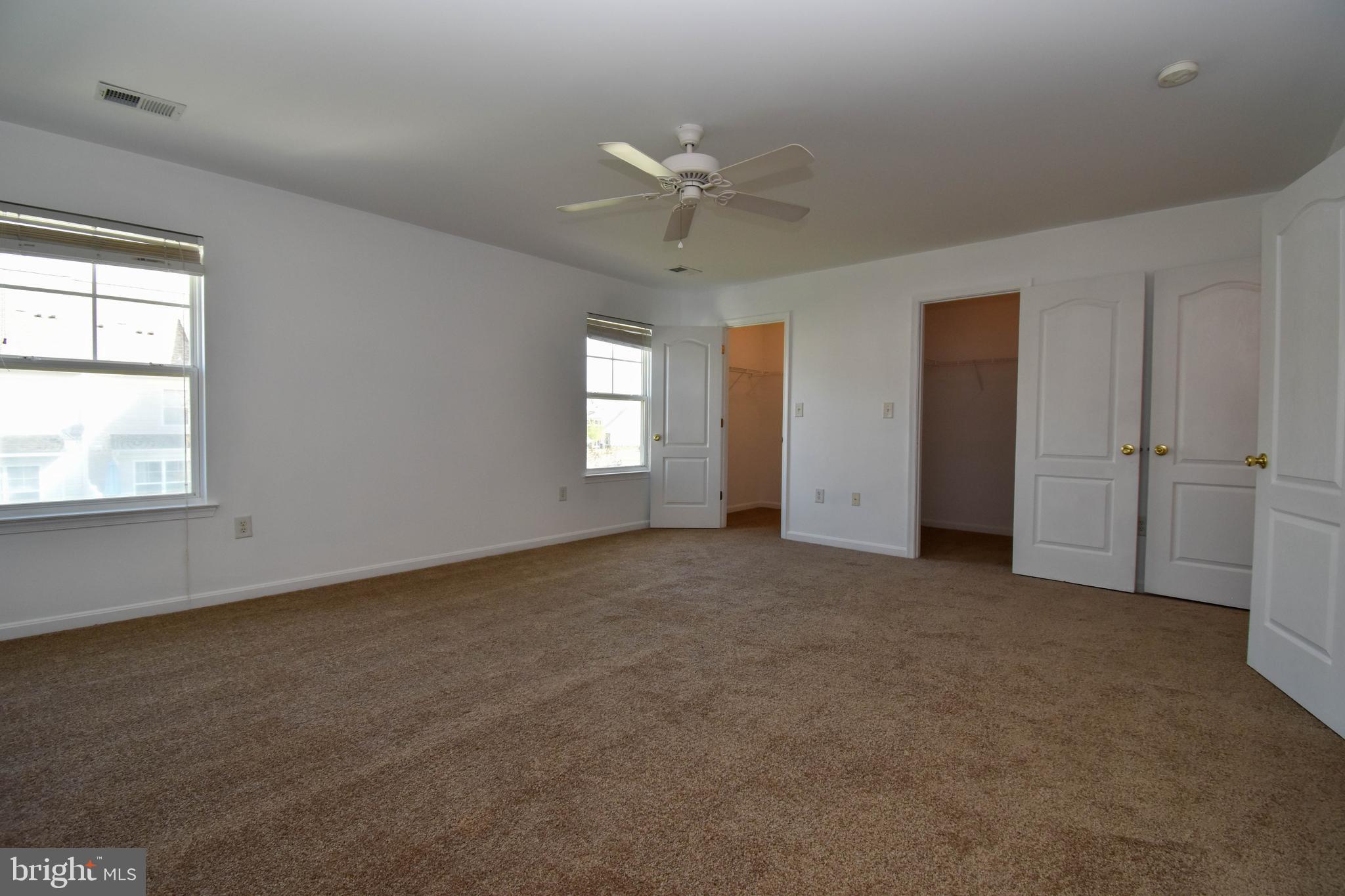 29549 Whitstone Lane, Unit 1305 Millsboro, DE 19966 - Photo 15 of 31 a view of an empty room with a window